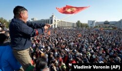 People protest during a rally against the results of a parliamentary vote in Bishkek in October 2020.