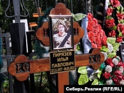The grave of Ilya Piryazev who had served in several Russian military campaigns before dying in Ukraine.