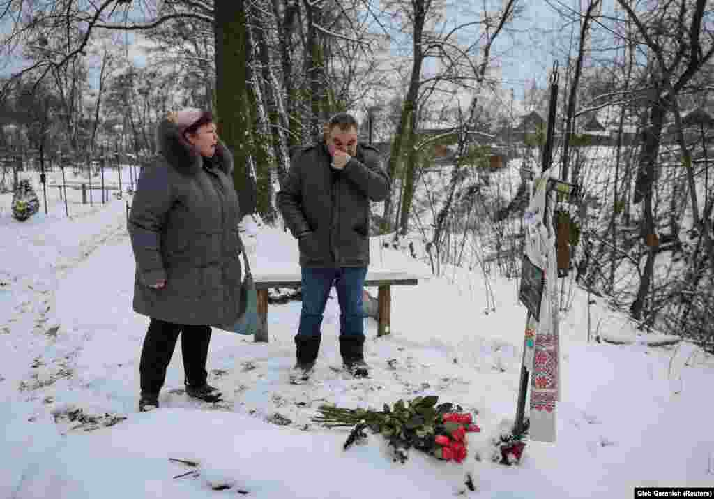 On a cold February day, Safonova was joined by Shchyruk as they visited Filkina's grave in Bucha. They struggled to hold back their tears after placing 12 pink roses near the simple cross that marks her final resting place.