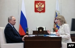 Vladimir Putin (left) and his children's rights commissioner, Maria Lvova-Belova, have been charged by the International Criminal Court with war crimes for the "unlawful deportation" of Ukrainian children to Russia.