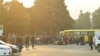 Residents gather next to buses in central Stepanakert before leaving Nagorno-Karabakh, September 25, 2023.