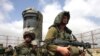 سرباز اسرائیلی در گشت نگهبانی در مرز غزه و اسرائیل. (عکس از AFP)