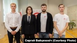 Belarusian labor organizer Syarhey Vaytsyakhovich (right) poses for a photo with opposition leader Svyatlana Tsikhanouskaya (second from left).
