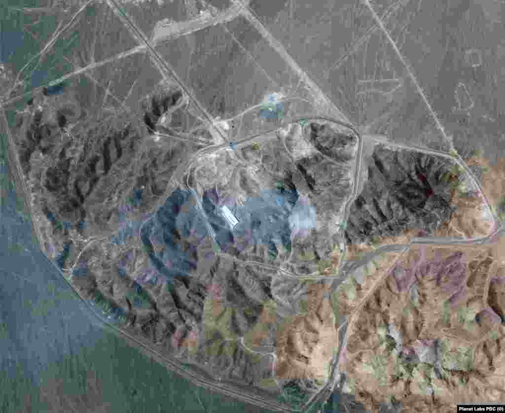 Smoke is seen rising from impact craters left by the US strike on Iran's fuel enrichment facility at Fordow in a satellite image taken on June 22.