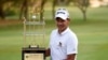 Thailand's Tirawat Kaewsiribandit poses with the winning trophy in Karachi on October 14.