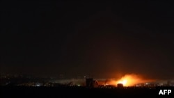 A fireball ignites as Ukrainian air defenses deploy against Russian drones during a night mass drones and missiles strike in Kyiv. (file photo)
