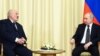 Russian President Vladimir Putin (right) meets with Belarusian ruler Alyaksandr Lukashenka outside Moscow on February 17.