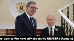 Moscow, Russia--Russian President Vladimir Putin greets Serbian President Aleksandar Vucic, May 9 2025