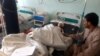 An Afghan boy who was allegedly injured in an airstrike on an Islamic seminary receives medical treatment at a hospital in Takhar on October 22.