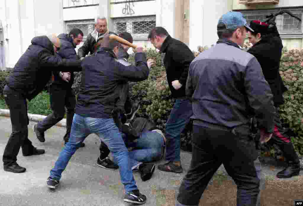 Russian separatists beat a pro-Ukrainian man with a bat and whip in Sevastopol on March 9, as a rally in support of Kyiv was attacked by pro-Russian activists. 