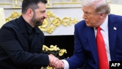 Ukraine President Volodymyr Zelenskyy and US President Donald Trump shake hands during a meeting in the Oval Office of the White House in Washington, D.C., on August 18, 2025. 