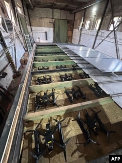An image released by the Security Service of Ukraine showing drones hidden in a false roof that was purportedly fitted onto a truck ahead of the June 1 strikes.