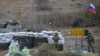 Russian peacekeepers are stationed outside the town of Kalbacar on November 18, in an area of Azerbaijan being vacated by ethnic Armenians after three decades.