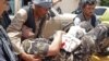One of the people wounded in the attack is is brought on a stretcher to a hospital in the city of Aybak on July 13. 
