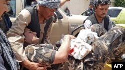 One of the people wounded in the attack is is brought on a stretcher to a hospital in the city of Aybak on July 13.