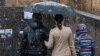 Armenia - A young couple and their child are seen walking in Yerevan, 1Nov2016.