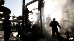 Under proposed legislation passed by parliament, Iranian government employees like these oil workers would get a new day off on Saturday.