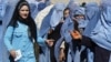 FILE: Afghan widows wait to receive monthly rations from the World Food Program in Kabul.