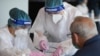 ROMANIA -- A man is tested for the novel coronavirus COVID-19 at the National Arena stadium in Bucharest, June 10, 2020