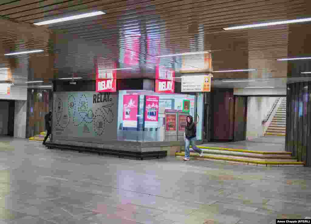 A plaque to Vladimir Lenin inside a metro station that was called Leninova when this 1978 photo was taken. The quote alongside the plaque comes from a propaganda poem: "None are more alive than Lenin in this world. Our strength, our wisdom are the surest of weapons." This plaque reportedly still lurks among the cobwebs and cables behind the newsstand in the station now named Dejvicka. 