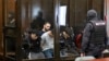 Defendants accused of involvement in the 2024 Crocus City Hall music venue gun attack that killed more than 140 people go on trial in Moscow on August 4. 