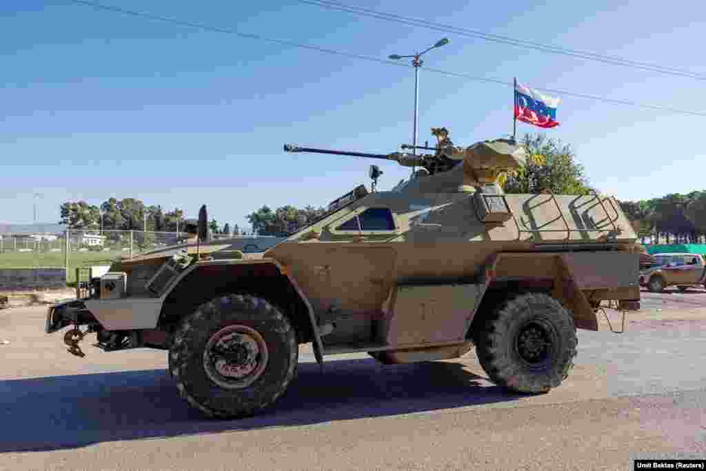 A Russian armored vehicle near the Hmeimim base. Ben Dubow, a senior fellow at the Center for European Policy Analysis, told RFE/RL on December 13 that members of Syria's de facto government have "expressed a willingness to engage with Russia and have spoken favorably of Russia in comparison to Iran," but he adds that "this is a newer development in line with their attempts to project moderation and international legitimacy."