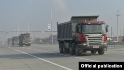 Armenia - Trucks pass through a newly expanded highway running south of Yerevan, 29Dec2015. 