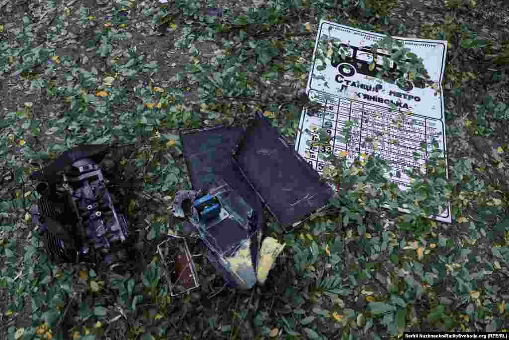 Pieces of an engine alongside a sign for the Lukyanivska underground station seen on July 21. The station is located alongside Ukraine's first McDonalds, which opened in 1997, and across the road from a prominent high-rise building.