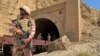 Pakistani soldiers stand at a tunnel where a train was attacked by separatist militants in Balochistan on March 15. Pakistan's border regions near Afghanistan have seen an uptick in insurgent violence in recent years. 