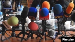 Armenia -- TV and radio microphones laid out during a news conference in Yerevan.