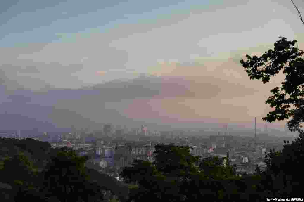 Smoke and mist seen over the Kyiv skyline at dawn on July 10. Local authorities warned residents to close their windows "after returning home from the bomb shelters" due to the amount of smoke blanketing the capital.