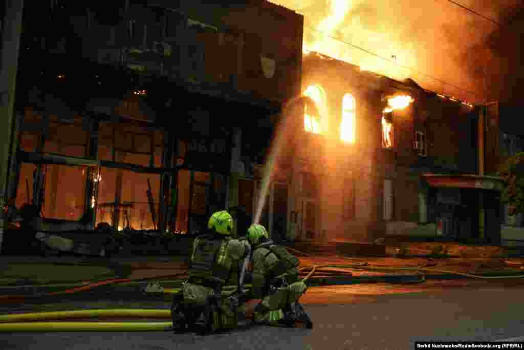 Firefighters battle a blaze in Kyiv after the strikes.