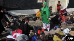 Fotografia luată la 6 decembrie 2011, pentru care Massoud Hossaini a primit premiul Pulitzer