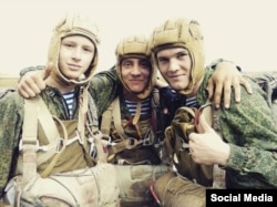 In this undated photograph taken from Russian social media, a Russian soldier identified as Roman Zyazin (right) is shown with other personnel.