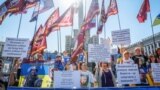Relatives of missing Ukrainian soldiers hold flags and signs while attending a rally as the country celebrates Independence Day in central Kyiv on August 24.