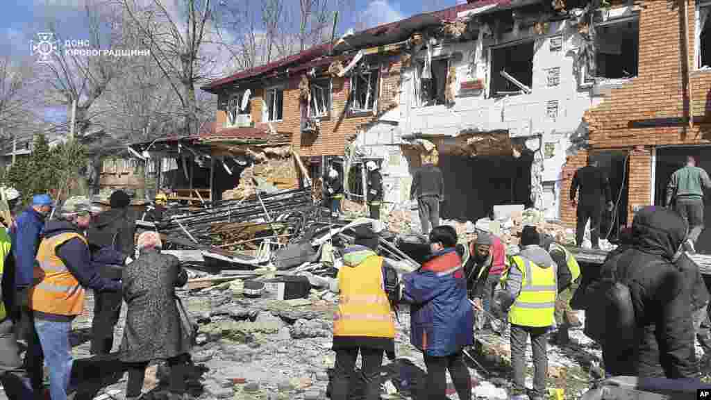 Residents of an apartment block in Ukraine's central Kirovohrad region clear rubble on March 20 after a Russian drone strike.In early March, Ukraine had agreed to a full cease-fire during ongoing peace talks, but the proposal was rejected by Russia. "Who will determine where and who has violated a potential cease-fire agreement along 2,000 kilometers [front line]? And who will then blame whom for violating that agreement?" Russian President Vladimir Putin told reporters.