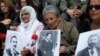 Turkey -- Turks hold up pictures of Armenian intellectuals rounded up and executed in 1915 during a public commemoration in Istanbul, 24Apr2010