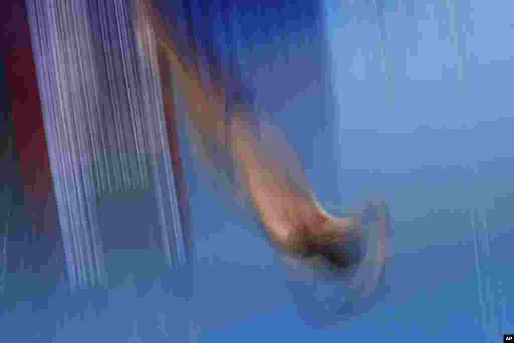 Iran's Sam Vajerhelabad ocompetes in the men's 3-meter springboard diving preliminaries at the World Aquatics Championships in Singapore.