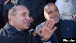Armenia -- Parliament speaker Hovik Abrahamian (L) urges opposition leader Raffi Hovannisian to end his hunger strike, 25Mar2011.