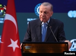 Turkish President Recep Tayyip Erdogan, seen here speaking in Malaysia last month, has been in power for more than 20 years.