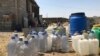 Емкости под привозную воду во дворе дома в микрорайоне Северный жилмассив. Шымкент, 19 августа 2019 года.