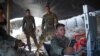 U.S. Army soldiers from NATO looks on as they use a cruise system in a checkpoint during a patrol against militants at the Deh Bala district in the eastern province of Nangarhar.