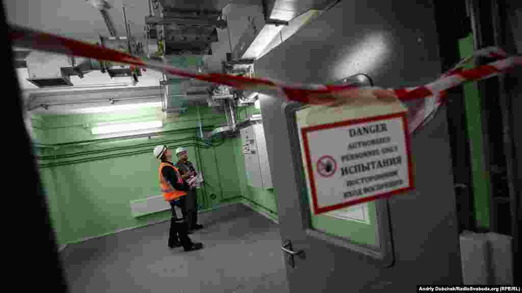 Workers at Chernobyl's New Safe Confinement (NSC) inspect new equipment. Two years after the structure was put into position, containment systems are still being installed and tested. The cost of the shield was almost $1.6 billion, with funding coming from the European Bank for Reconstruction and Development. 