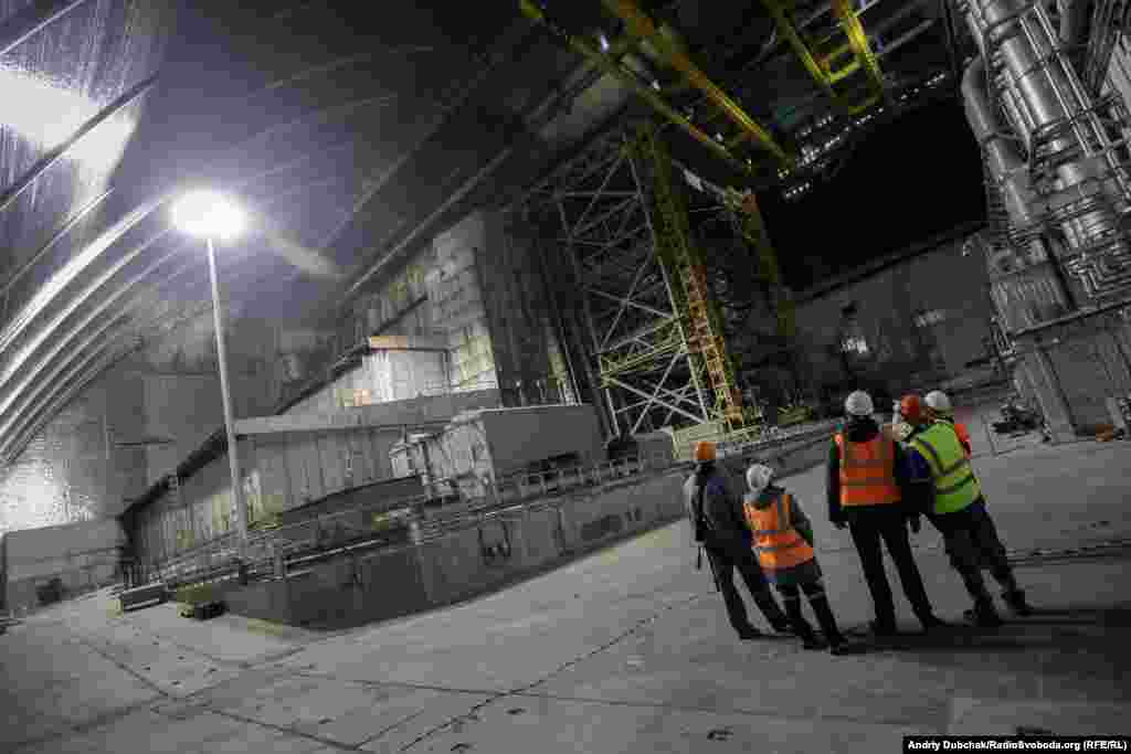 The old concrete sarcophagus under the New Safe Confinement (NSC). There remains an estimated 200 tons of radioactive fuel inside the crippled reactor.