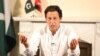 Pakistan's cricketer-turned politician Imran Khan, head of the Pakistan Tehreek-e-Insaf (Movement for Justice) party, addresses the nation at his residence in Islamabad a day after the elections on July 26.