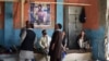 Afghan wrestlers gather at the site of a suicide attack on the morning after a blast targeted wrestlers during a training session at the Maiwand Club in Kabul on September 6.