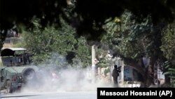 A special-forces soldier fires his weapon during a clash between insurgents and security forces in Kabul on August 16.