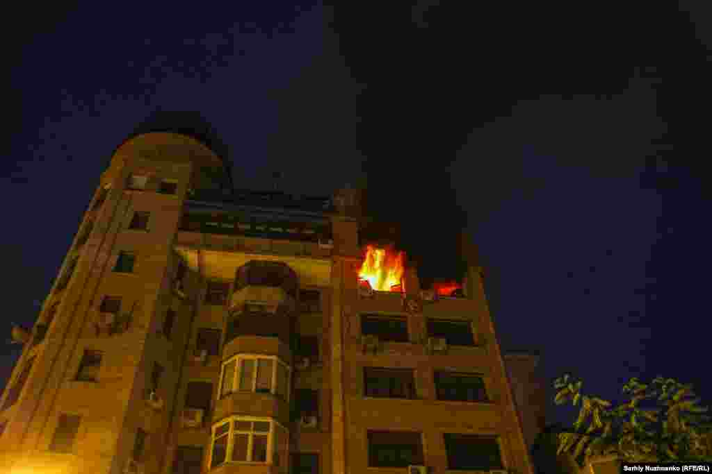 A fire burns in an apartment building hit by a Russian strike in the early hours of July 10.