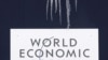 Switzerland -- Icicles hang over the World Economic Forum's logo in Davos, 26Jan2009