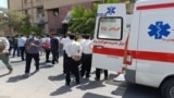 Iranian emergency workers attend the aftermath of a deadly attack on a courthouse in the southeastern city of Zahedan on July 26. 
